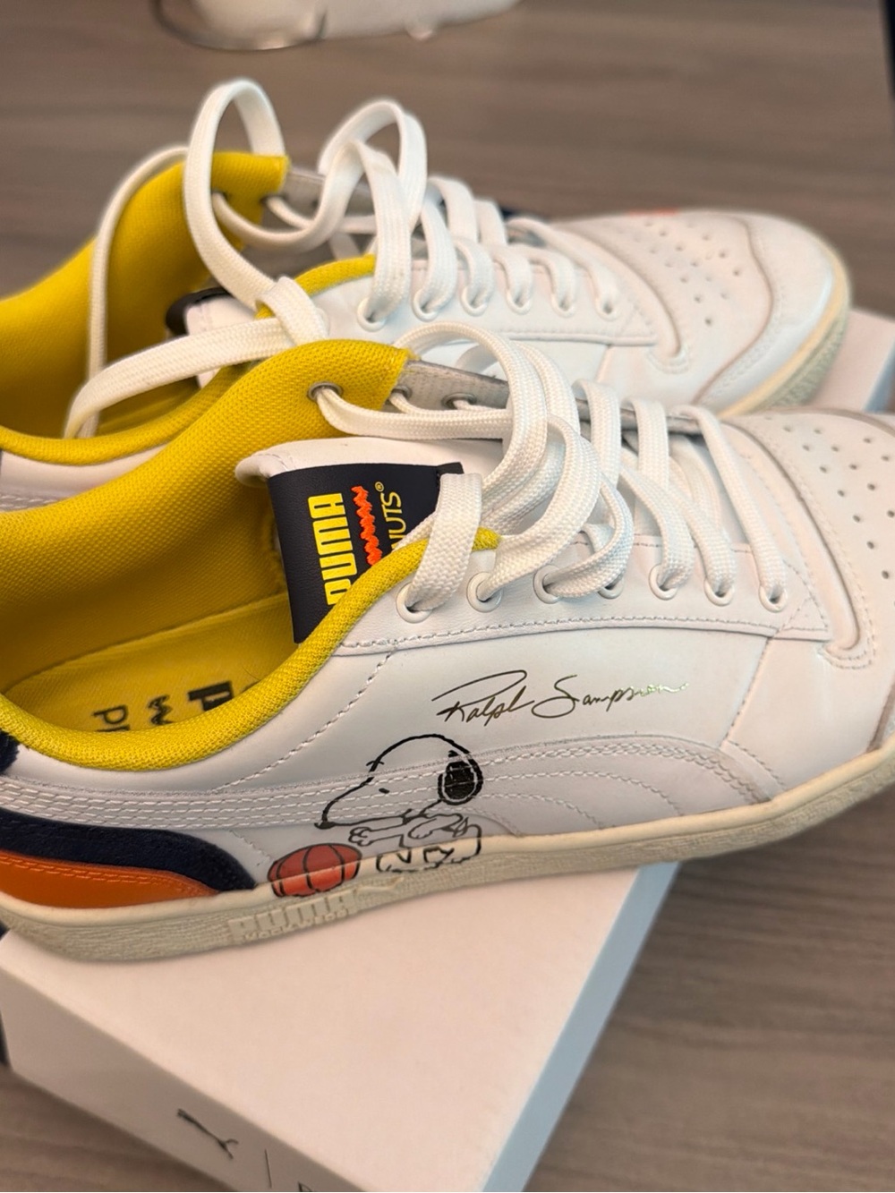 Puma White Sneakers with Yellow Lining and Navy/Orange Accents